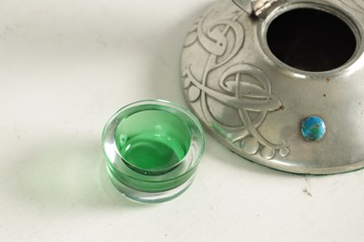 Lot 555 - AN ARTS AND CRAFTS TUDRIC PEWTER CIRCULAR INK WELL AND LINER AFTER DESIGNS BY ARCHI BALD KNOX