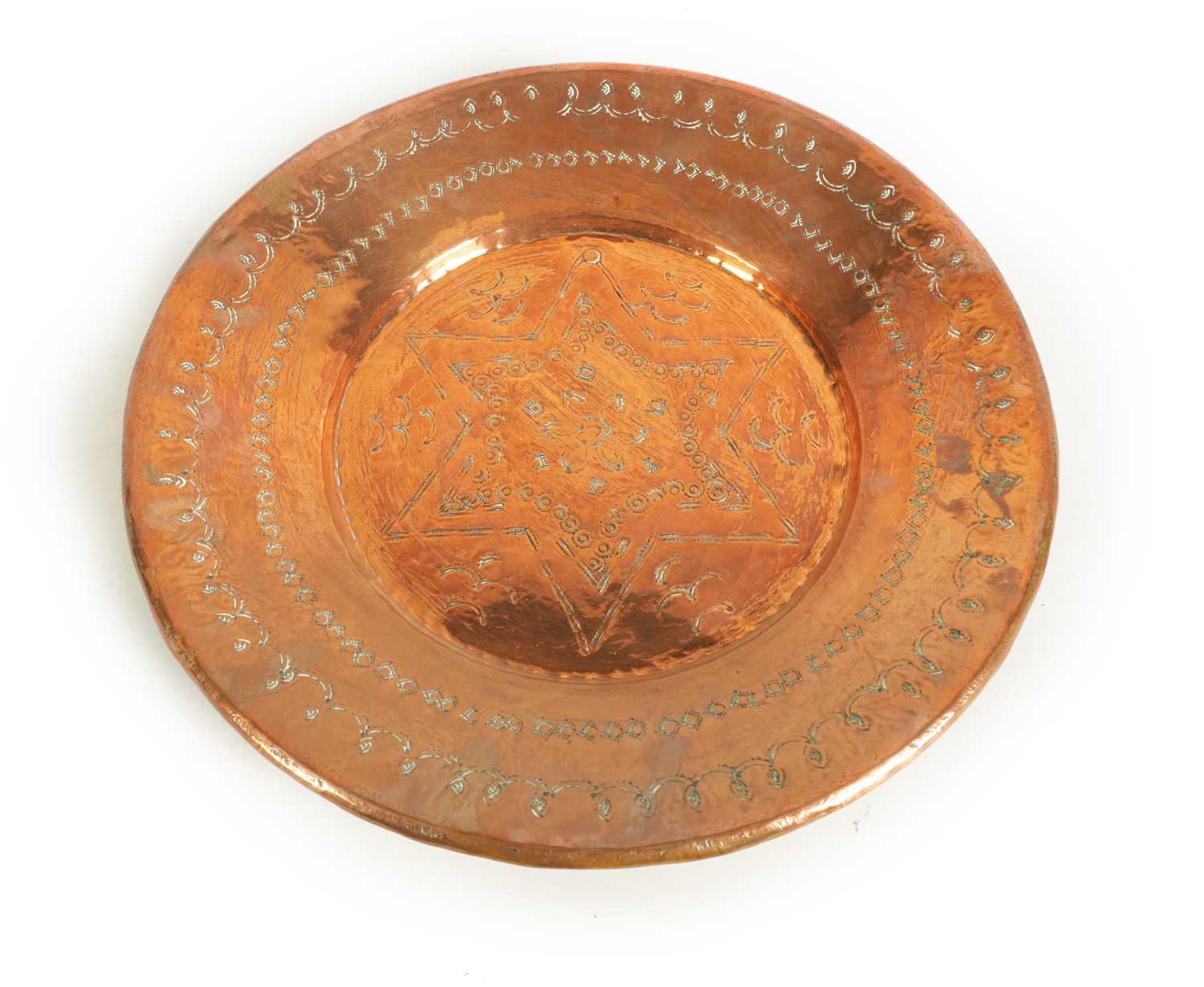 Lot 560 - AN ARTS AND CRAFTS HAMMERED COPPER HANGING CHARGER