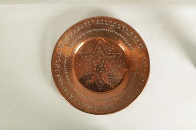 Lot 560 - AN ARTS AND CRAFTS HAMMERED COPPER HANGING CHARGER