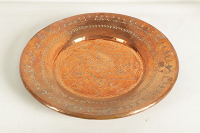 Lot 560 - AN ARTS AND CRAFTS HAMMERED COPPER HANGING CHARGER