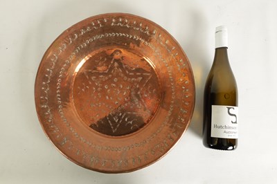 Lot 560 - AN ARTS AND CRAFTS HAMMERED COPPER HANGING CHARGER