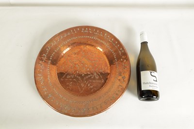 Lot 560 - AN ARTS AND CRAFTS HAMMERED COPPER HANGING CHARGER