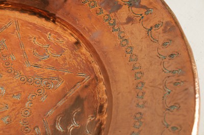 Lot 560 - AN ARTS AND CRAFTS HAMMERED COPPER HANGING CHARGER