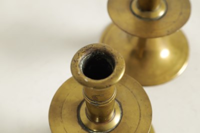 Lot 542 - A RARE PAIR OF 17TH/18TH CENTURY ENGLISH BRASS TRUMPET CANDLE STICKS