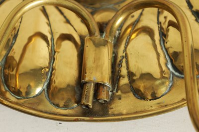 Lot 559 - AN ARTS AND CRAFTS NEWLYN SCHOOL BRASS HANGING OVAL TWO BRANCH WALL SCONCE