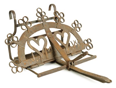Lot 530 - AN 18TH/19TH CENTURY IRONWORK HANGING FIREFRONT MARRIAGE TRIVET
