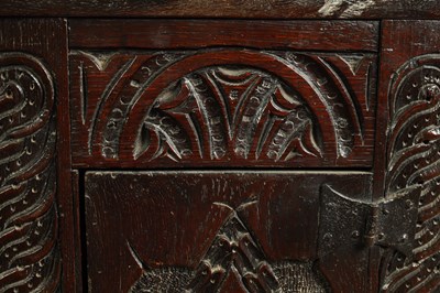 Lot 1025 - A 17TH-CENTURY SMALL CARVED OAK HANGING CORNER CUPBOARD