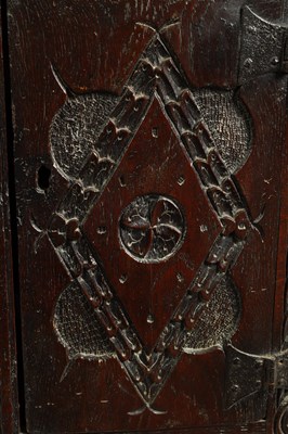 Lot 1025 - A 17TH-CENTURY SMALL CARVED OAK HANGING CORNER CUPBOARD