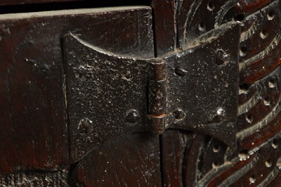 Lot 1025 - A 17TH-CENTURY SMALL CARVED OAK HANGING CORNER CUPBOARD