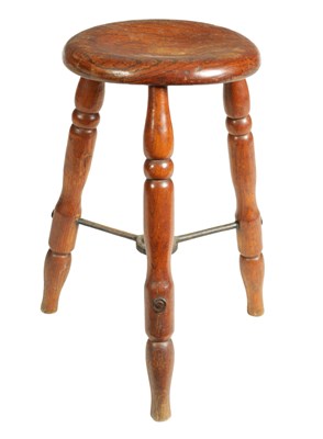 Lot 976 - A 19TH-CENTURY ELM STOOL WITH DISHED CIRCULAR SEAT ON THREE TURNED SPLAYED LEGS JOINED BY AN IRON WORK UNDER STRETCHER