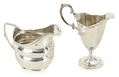 Lot 302 - A GEORGE III SILVER MILK JUG OF OBLATE FORM