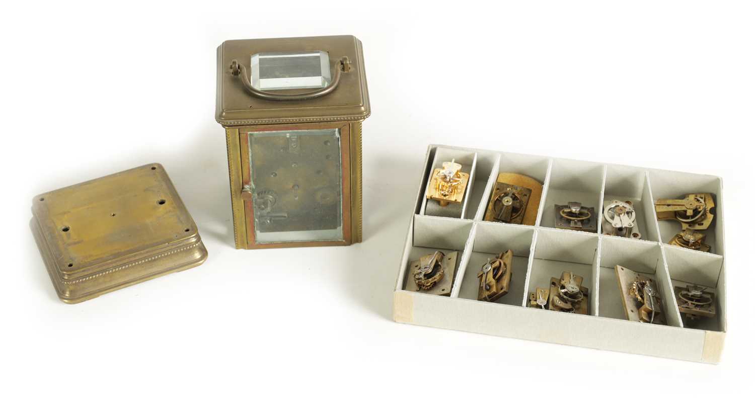 Lot 207 - A BOXED COLLECTION OF CARRIAGE CLOCK LEVER AND BALANCE WHEEL PLATFORM ESCAPEMENTS