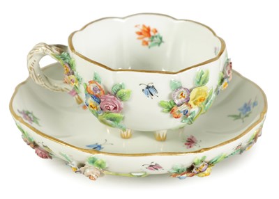 Lot 71 - A LATE 19TH CENTURY SHAPED MOULDED MEISSEN CUP AND SAUCER