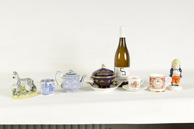 Lot 77 - AN EARLY 19TH CENTURY STAFFORDSHIRE MODEL OF A ZEBRA, A STAFFORDSHIRE FIGURAL PEPPERETTE, A BLUE AND WHITE CUP, A TEAPOT WITH AN ORIENTAL LID, A ROYAL BLUE AND GILT PLATED BOWL ON STAND