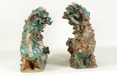 Lot 137 - A LARGE PAIR OF 19TH CENTURY GLAZED TERRACOTTA DOGS OF FO