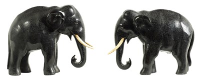 Lot 170 - A PAIR OF LATE 19TH CENTURY INDIAN CARVED EBONY ELEPHANTS