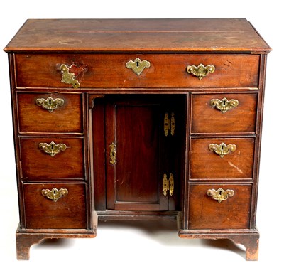 Lot 973 - AN EARLY 18TH CENTURY SOLID WALNUT KNEEHOLE DESK