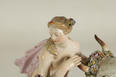 Lot 80 - A 19TH CENTURY MEISSEN FIGURE GROUP OF A BULL WITH A SEATED LADY RIDER AND A FLOWER SELLER