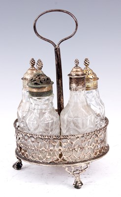 Lot 331 - A GEORGE III FIVE BOTTLE SILVER CRUET STAND...