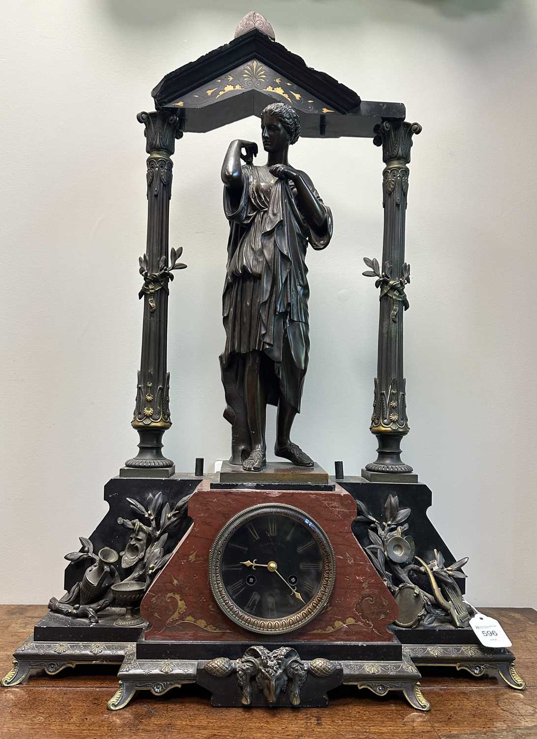 Lot 596 - A LATE 19TH CENTURY FRENCH BLACK SLATE AND ROUGE MARBLE BRONZE FIGURAL MANTEL CLOCK