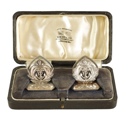 Lot 392 - A CASED PAIR OF SILVER ROYAL NAVY MENU HOLDERS