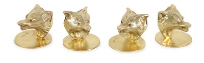 Lot 383 - A SET OF FOUR SILVER GILT WOLF HEAD MENU HOLDERS