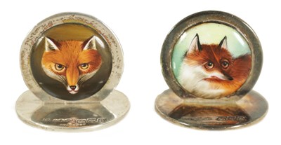 Lot 436 - A PAIR OF SILVER AND ENAMEL FOX MASK MENU HOLDERS