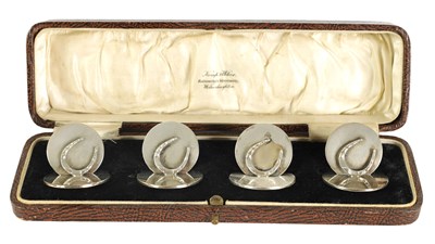 Lot 386 - A CASED SET OF FOUR NOVELTY HORSESHOE MENU HOLDERS