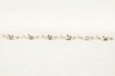 Lot 403 - A CASED SET OF SIX SILVER ANIMAL MENU HOLDERS/NAPKIN RINGS