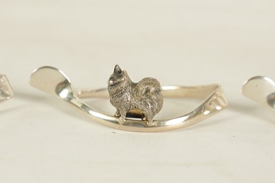 Lot 403 - A CASED SET OF SIX SILVER ANIMAL MENU HOLDERS/NAPKIN RINGS