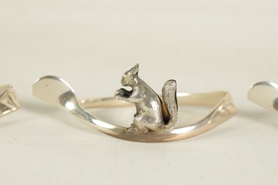 Lot 403 - A CASED SET OF SIX SILVER ANIMAL MENU HOLDERS/NAPKIN RINGS