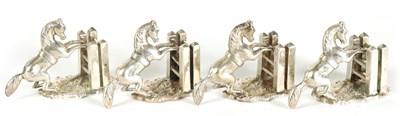 Lot 470 - A SET OF FOUR SILVER HORSE MENU HOLDERS