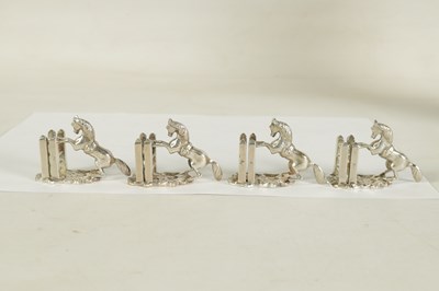 Lot 470 - A SET OF FOUR SILVER HORSE MENU HOLDERS