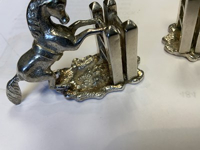 Lot 470 - A SET OF FOUR SILVER HORSE MENU HOLDERS