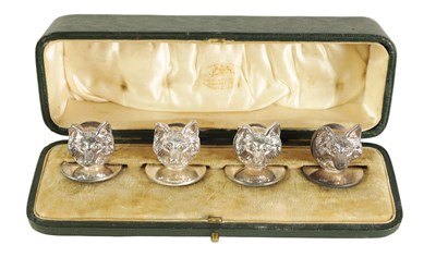 Lot 452 - A CASED SET OF FOUR FOX MASK MENU HOLDERS