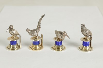 Lot 324 - A CASED SET OF FOUR SILVER AND GUILLOCHE ENAMEL GAME BIRD MENU HOLDERS