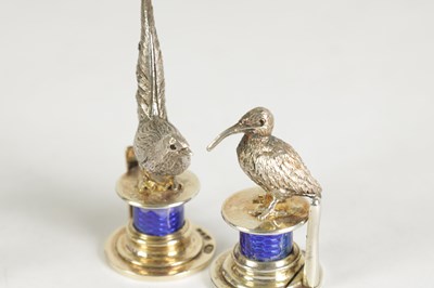 Lot 324 - A CASED SET OF FOUR SILVER AND GUILLOCHE ENAMEL GAME BIRD MENU HOLDERS