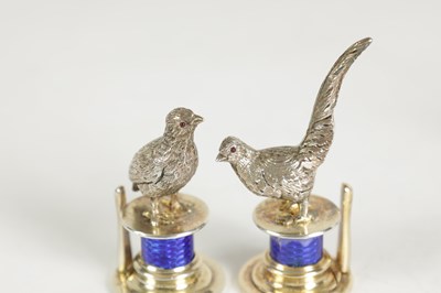 Lot 324 - A CASED SET OF FOUR SILVER AND GUILLOCHE ENAMEL GAME BIRD MENU HOLDERS