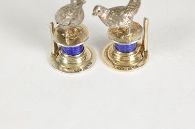 Lot 324 - A CASED SET OF FOUR SILVER AND GUILLOCHE ENAMEL GAME BIRD MENU HOLDERS