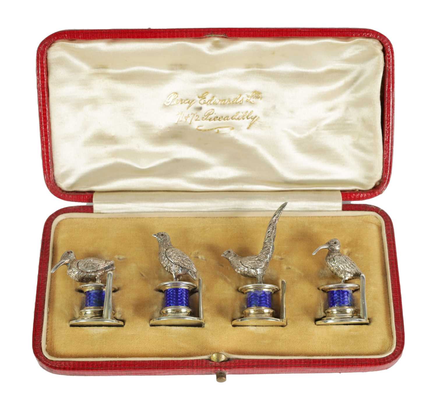 Lot 324 - A CASED SET OF FOUR SILVER AND GUILLOCHE ENAMEL GAME BIRD MENU HOLDERS