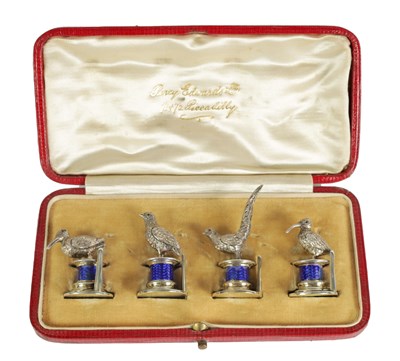 Lot 324 - A CASED SET OF FOUR SILVER AND GUILLOCHE ENAMEL GAME BIRD MENU HOLDERS