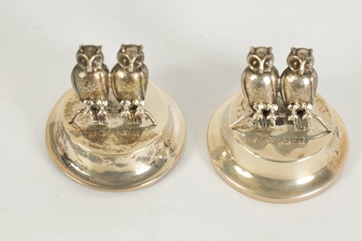 Lot 473 - A CASED PAIR OF EDWARDIAN SILVER OWL MENU HOLDERS