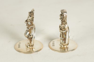 Lot 352 - A SET OF THREE CAST SILVER FIGURAL MENU HOLDERS OF PUNCH AND JUDY AND DOG