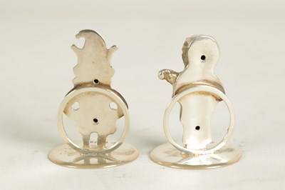 Lot 352 - A SET OF THREE CAST SILVER FIGURAL MENU HOLDERS OF PUNCH AND JUDY AND DOG