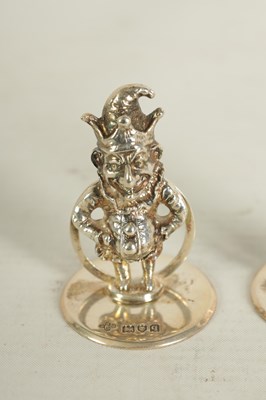 Lot 352 - A SET OF THREE CAST SILVER FIGURAL MENU HOLDERS OF PUNCH AND JUDY AND DOG