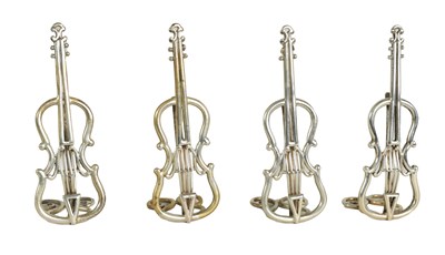 Lot 467 - A SET OF FOUR LATE 19TH CENTURY SILVER CELLO MENU HOLDERS