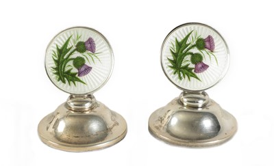 Lot 437 - A PAIR OF SILVER AND GUILLOCHE ENAMEL SCOTCH THISTLE MENU HOLDERS