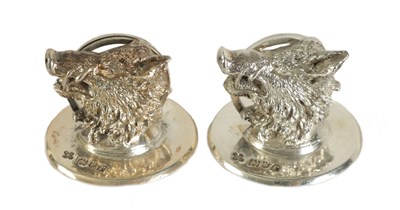 Lot 423 - A PAIR OF CAST SILVER BOAR’S HEAD MENU HOLDERS