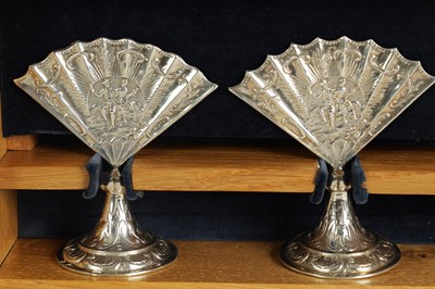 Lot 360 - A CASED SET OF FOUR LATE VICTORIAN NOVELTY SILVER MENU HOLDERS MODELLED AS FANS