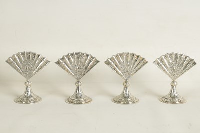 Lot 360 - A CASED SET OF FOUR LATE VICTORIAN NOVELTY SILVER MENU HOLDERS MODELLED AS FANS